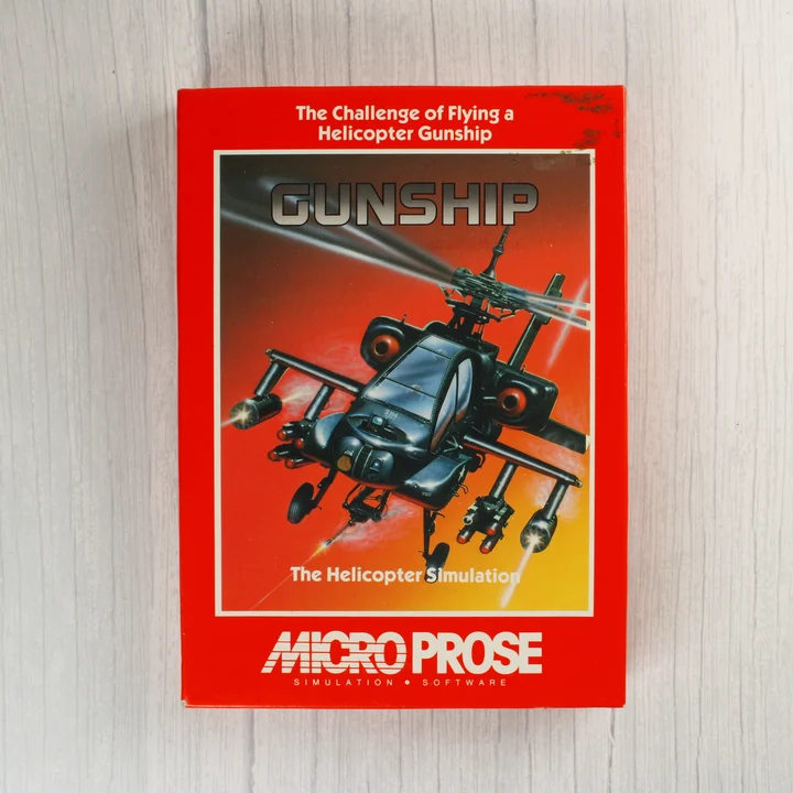 A Gunship videójáték piros dobozának előlapja egy helikopter grafikájával