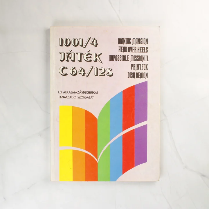 1001/4 Játék C64/128 könyv borítója színes sávokkal
