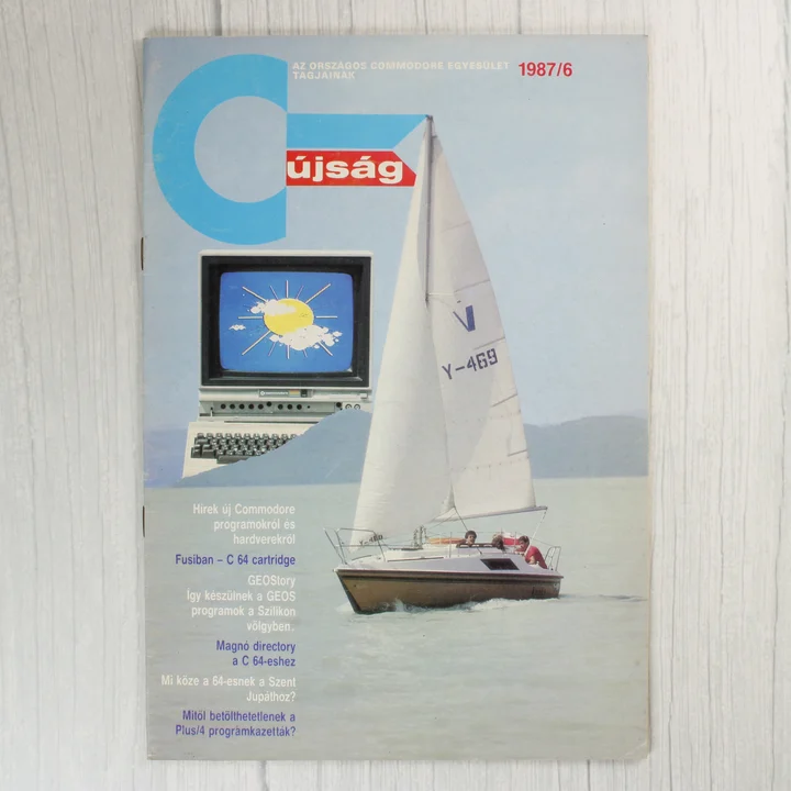 A Commodore újság 1987/6-os számának címlapja egy vitorlással és egy számítógéppel.