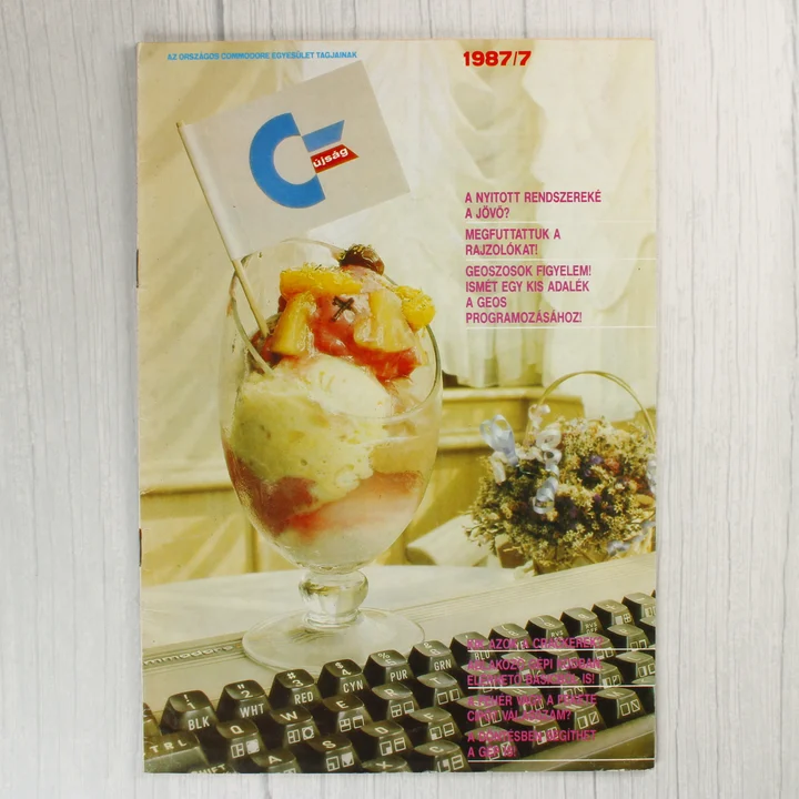 A Commodore újság 1987/7-es számának címlapja egy fagylaltkehellyel és billentyűzettel.