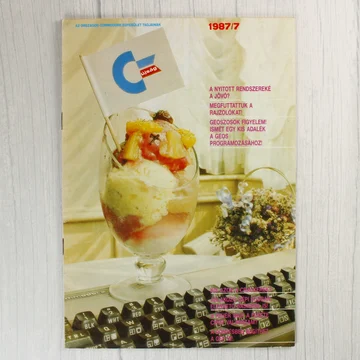 A Commodore újság 1987/7-es számának címlapja egy fagylaltkehellyel és billentyűzettel.