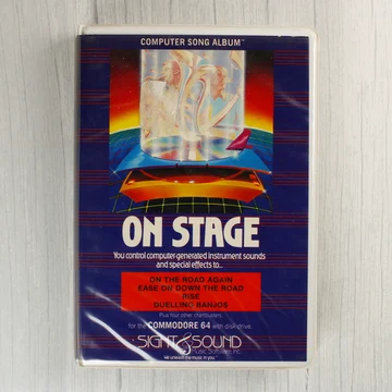 Az On Stage Computer Song Album Commodore 64-es verziójának elülső borítója műanyag tokban.