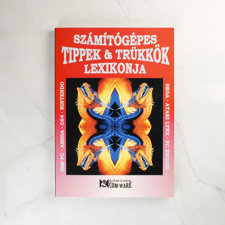 A Számítógépes Tippek & Trükkök Lexikonja könyv piros borítója sárkányos grafikával.