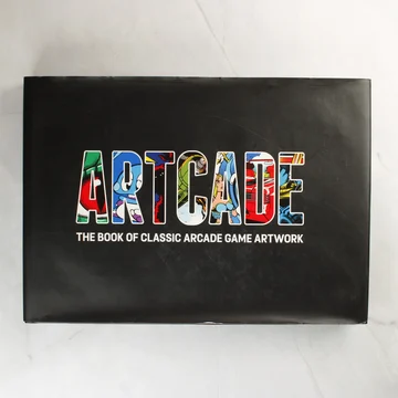 Az Artcade: The Book of Classic Arcade Game Artwork könyv fekete borítója színes felirattal.