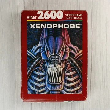 Xenophobe Atari 2600 videójáték dobozának előlapja