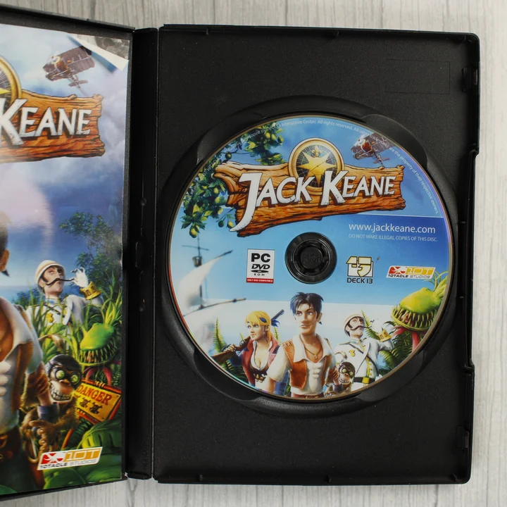 Jack Keane nyitott tok lemezzel és kézikönyvvel