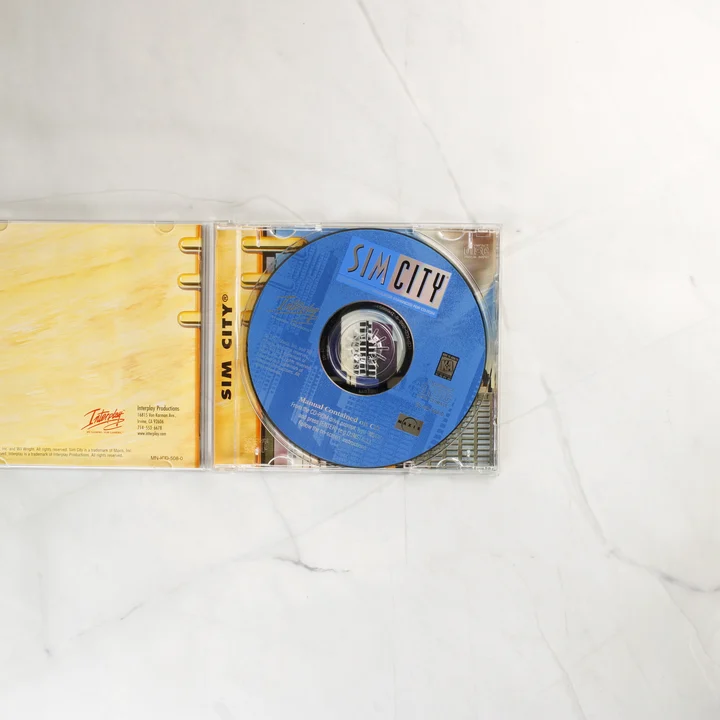 Nyitott SimCity CD-tok a lemezzel