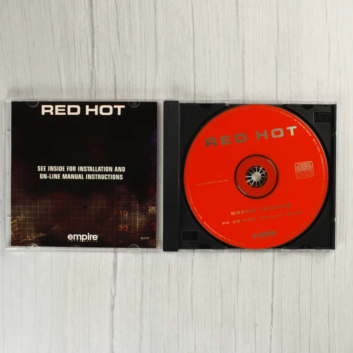 Nyitott CD-tok a Grand Touring lemezzel és füzettel