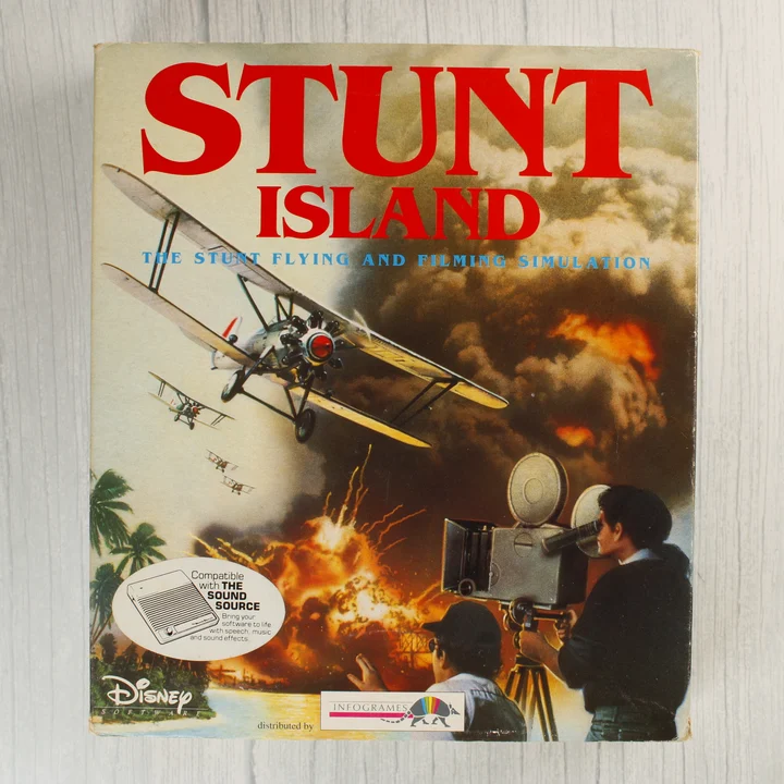 Stunt Island videójáték dobozának előlapja repülőgéppel és filmkamerával