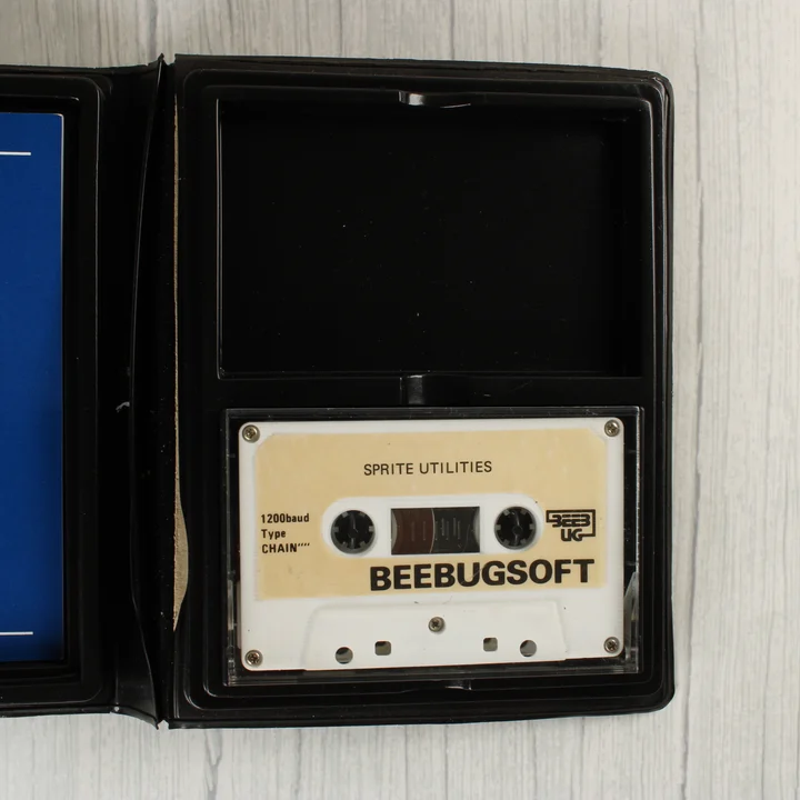 A nyitott tokban lévő Sprite Utilities kazetta