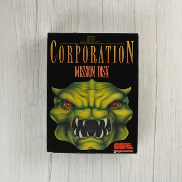 A Corporation: Mission Disk videójáték dobozának előlapja egy zöld szörnyeteggel