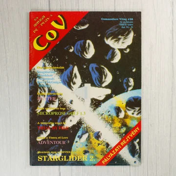 A Commodore Világ 26. számának színes borítója űrbéli grafikával.