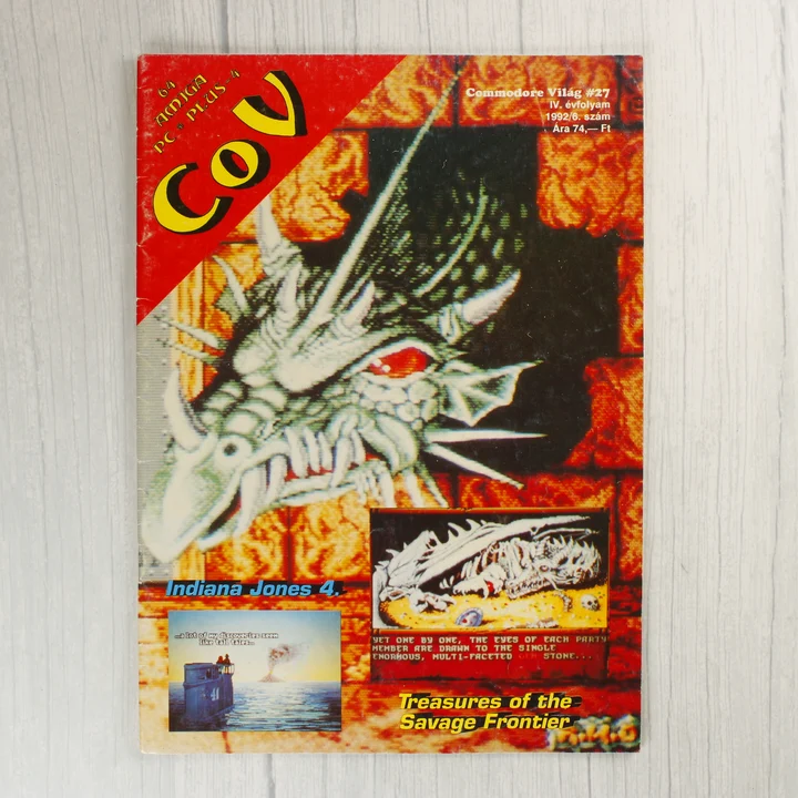 A Commodore Világ 27. számának színes borítója egy sárkányfejjel.