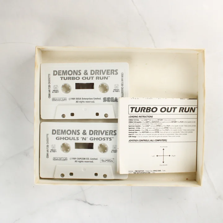 Demons & Drivers kazetták és útmutató a dobozban