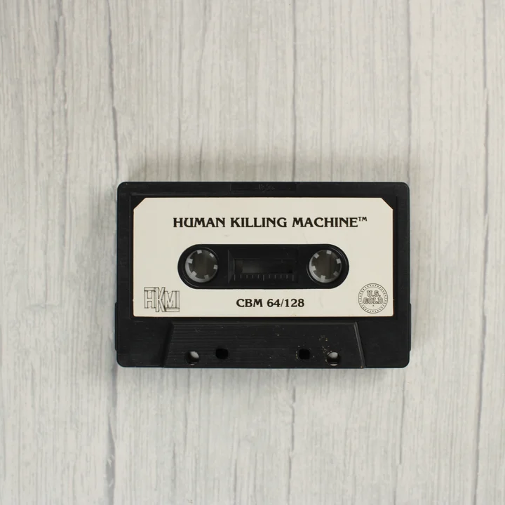 Human Killing Machine C64 kazetta Human Killing Machine Commodore 64 fekete adathordozó kazetta
