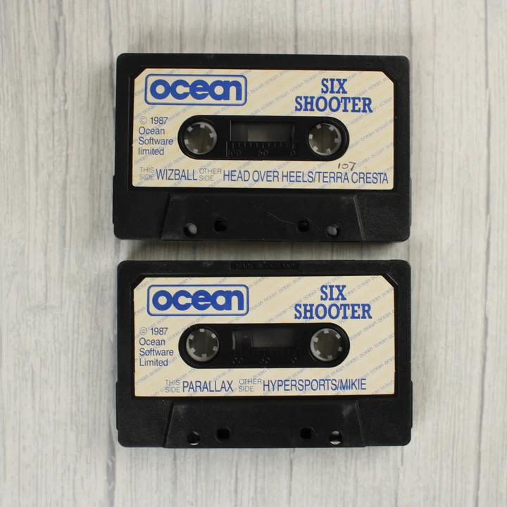Két fekete Ocean Six Shooter kazetta Commodore 64-hez