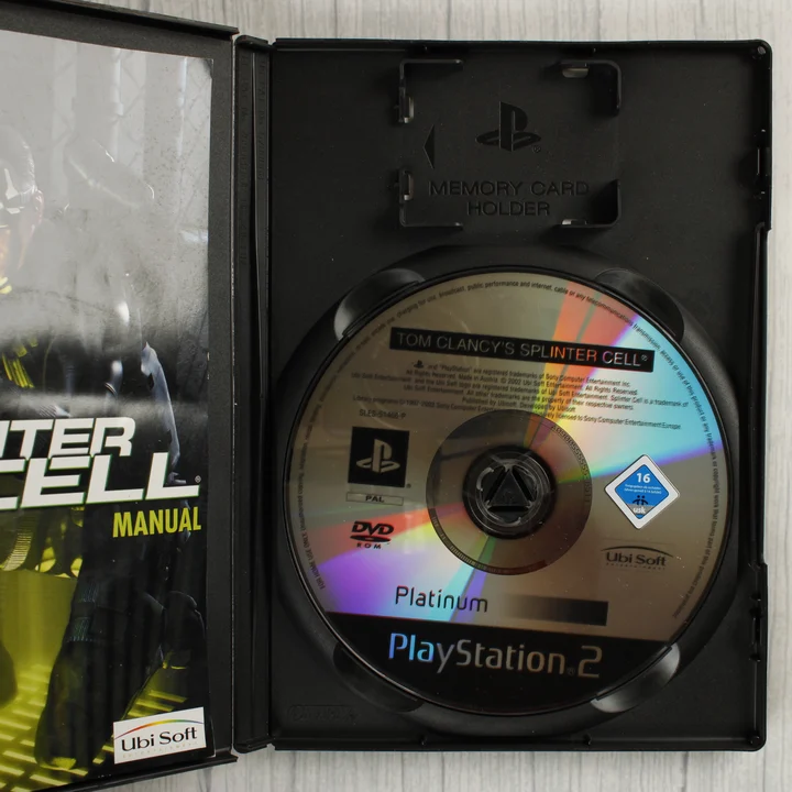 Nyitott Splinter Cell PS2 tok lemezzel és kézikönyvvel