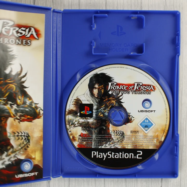 Nyitott PS2 tok a Prince of Persia lemezzel