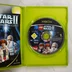 Nyitott Xbox tok a LEGO Star Wars II lemezzel és kézikönyvvel