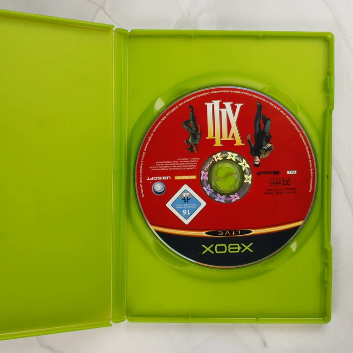 Nyitott Xbox tok a XIII játéklemezzel