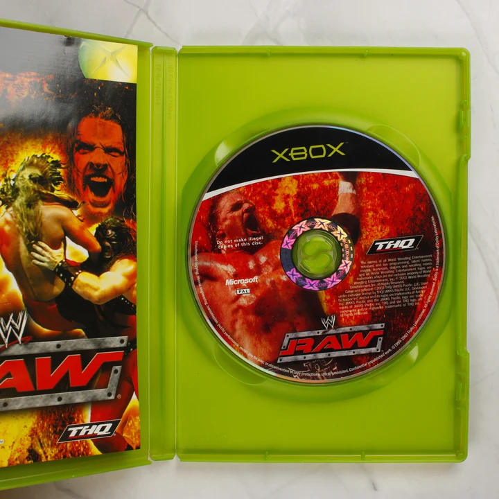 Nyitott WWE Raw Xbox tok a játéklemezzel