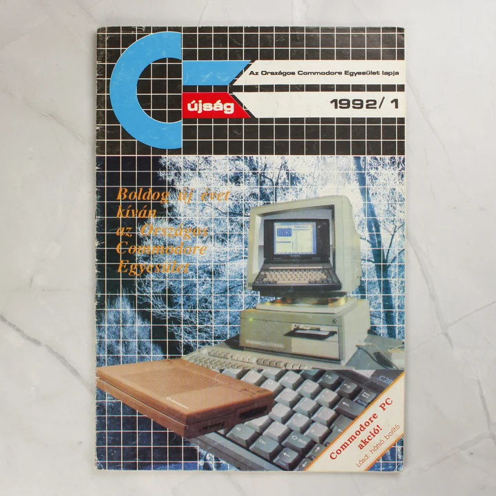A C-újság 1992/1-es számának színes borítója egy Commodore számítógéppel.