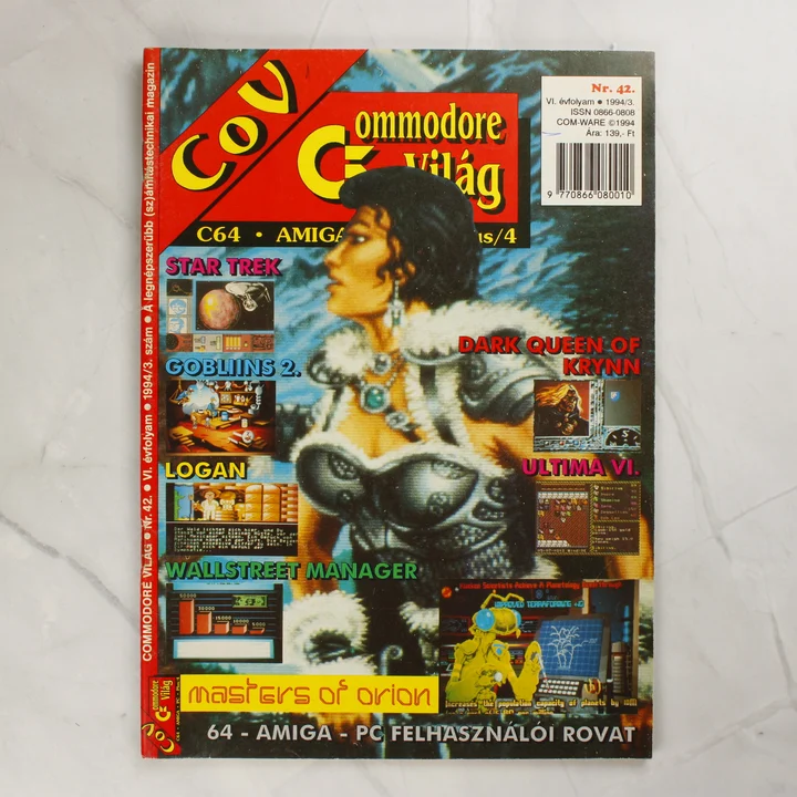 A Commodore Világ magazin 42. számának színes borítója fantasy illusztrációval és játékfeliratokkal.