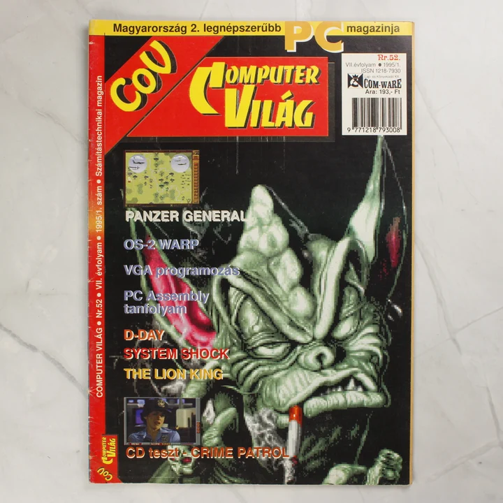 Commodore Világ 52. szám borító A Commodore Világ 52. számának színes borítója egy zöld szörnyeteggel.