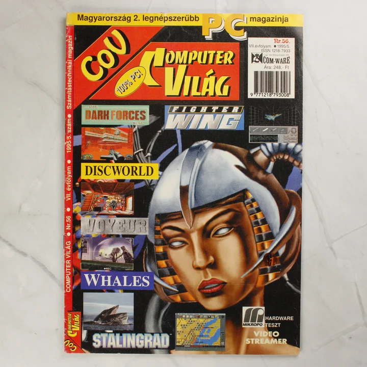 A Commodore Világ magazin 56. számának színes borítója egy futurisztikus női arccal.