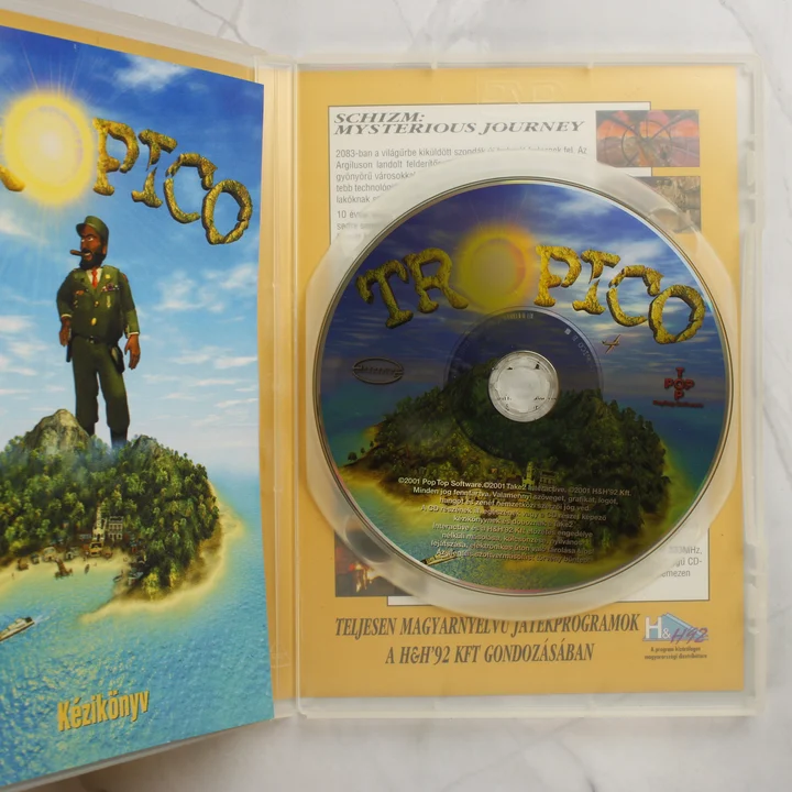 A Tropico PC játék nyitott tokja a lemezzel és kézikönyvvel