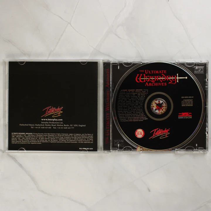 Nyitott CD-tok a The Ultimate Wizardry Archives lemezzel