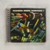Passengers: Original Soundtracks 1 CD előlapja futurisztikus grafikával