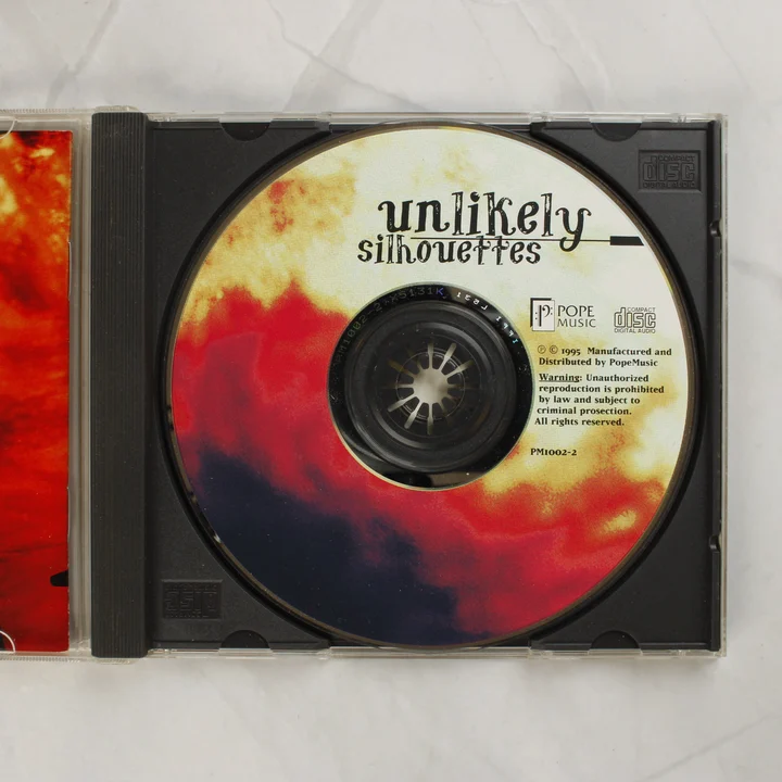 Unlikely Silhouettes CD lemez a nyitott tokban
