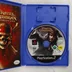 Nyitott PlayStation 2 tok a Pirates of the Caribbean lemezzel és kézikönyvvel