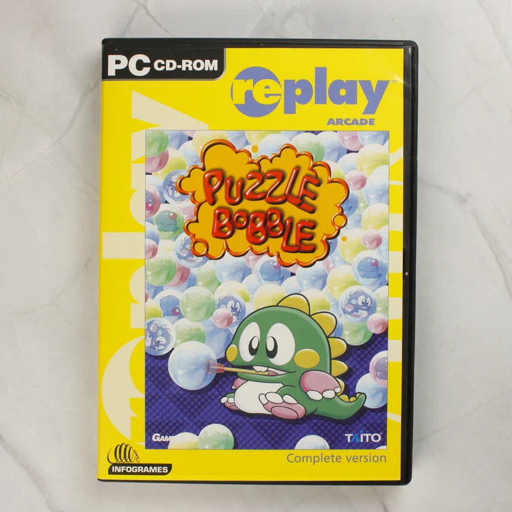 Puzzle Bobble PC játék sárga borítója fekete tokban