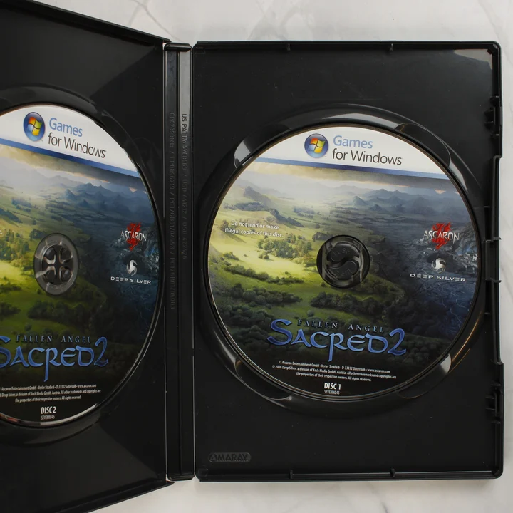 Sacred 2 Fallen Angel nyitott tok a két DVD lemezzel