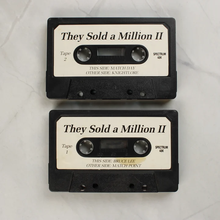 Két fekete magnókazetta a They Sold a Million II játékokkal.
