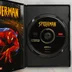 Nyitott Spider-Man videójáték tok a lemezzel és a füzettel