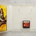Nyitott Nintendo DS tok a Guitar Hero cartridge-el