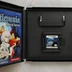 A nyitott Castlevania: Dawn of Sorrow játék tokja a cartridge-dzsel és az útmutatóval