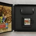 Nyitott Nintendo DS tok a Zelda Phantom Hourglass játékkal és kézikönyvvel