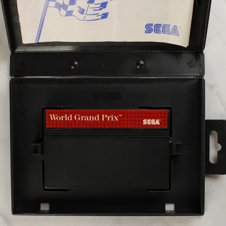 Nyitott World Grand Prix Sega Master System doboz cartridge-dzsal és útmutatóval