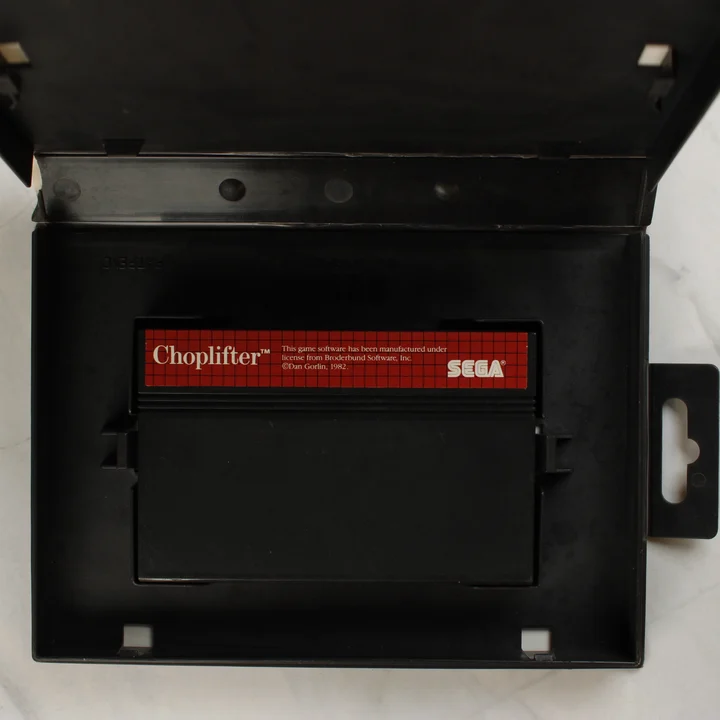 Choplifter cartridge a nyitott műanyag tokban