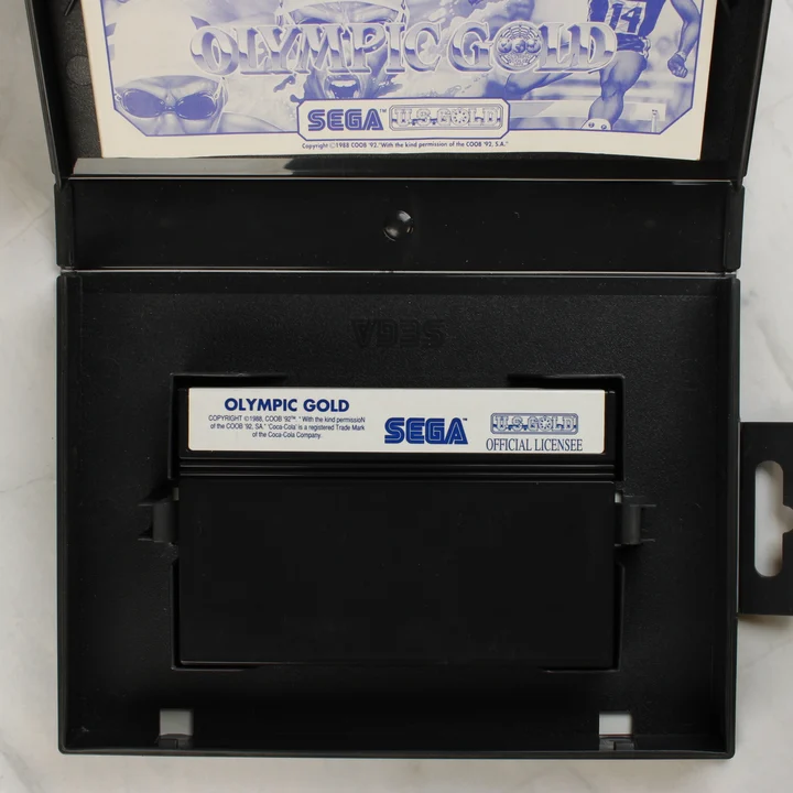 Olympic Gold Sega Master System nyitott doboz a cartridge-dzsel