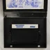 Nyitott tok az Impossible Mission cartridge-dzsel és kézikönyvvel