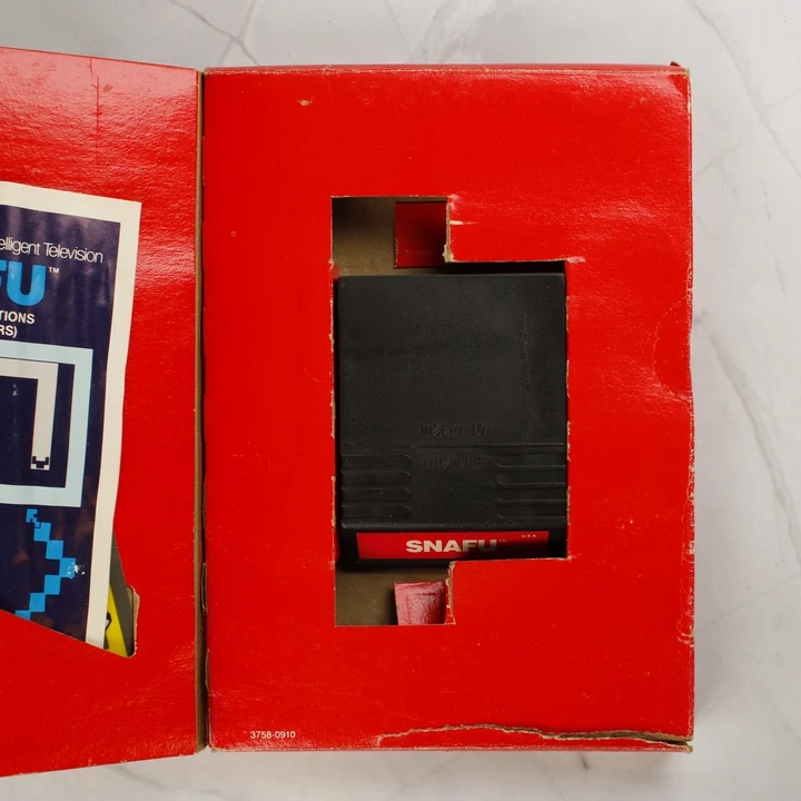 SNAFU videójáték cartridge a dobozában