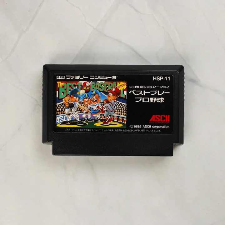 Fekete Famicom cartridge színes Best Play Baseball matricával.