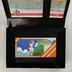 Nyitott Namco Classic játékdoboz a cartridge-dzsel és az útmutatóval