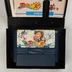 Nyitott Famista '90 doboz a cartridge-dzsel és az útmutatóval
