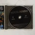 Nyitott CD-tok a Mortal Kombat lemezzel